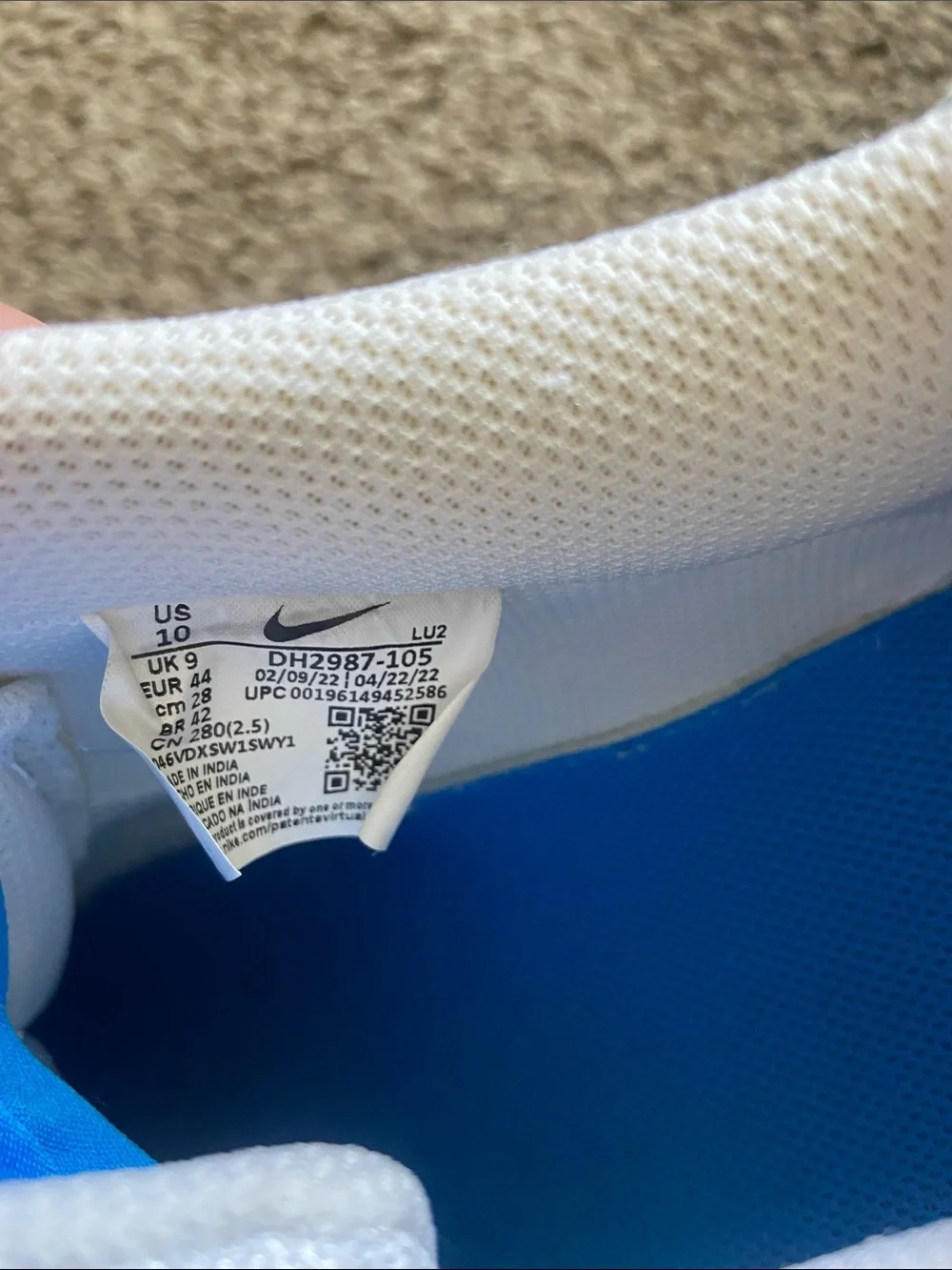 Nike White Low-Top Sneakers with Blue Swoosh